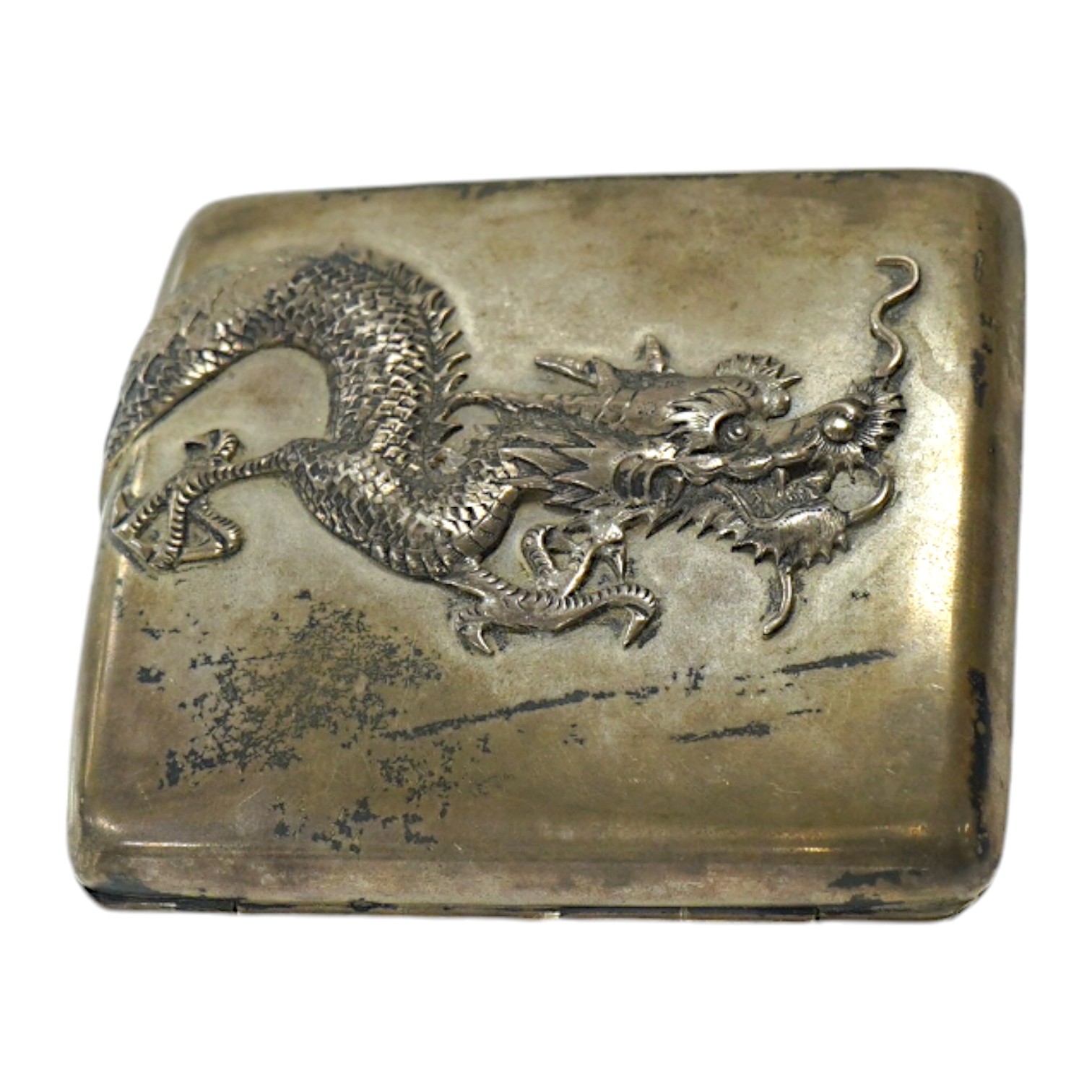 An early 20th century Chinese Export white metal cigarette case, by Sing Fat, with applied dragon decoration, 80mm, 3.8oz. Condition - fair